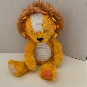 Make Believe Ideas Sensory Snuggable plush lion. Sensory rattle crinkle